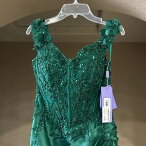 Green off the shoulder prom dress with a sequin top, slit, and trail bottom